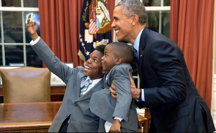 Dec. 4, 2015 “The President acquiesced to a selfie with 11-year-old Jacob Haynes and four-year-old James Haynes after taking a family photograph with departing White House staffer Heather Foster.” (Official White House Photo by Pete Souza)